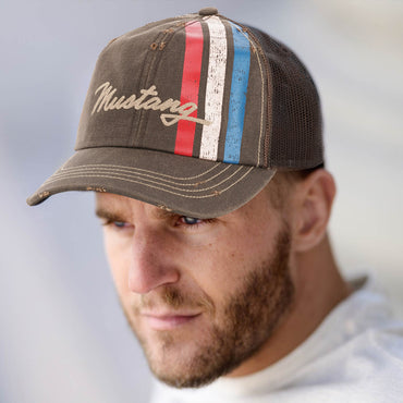 man with beard in distressed brown mustang hat with tribar logo