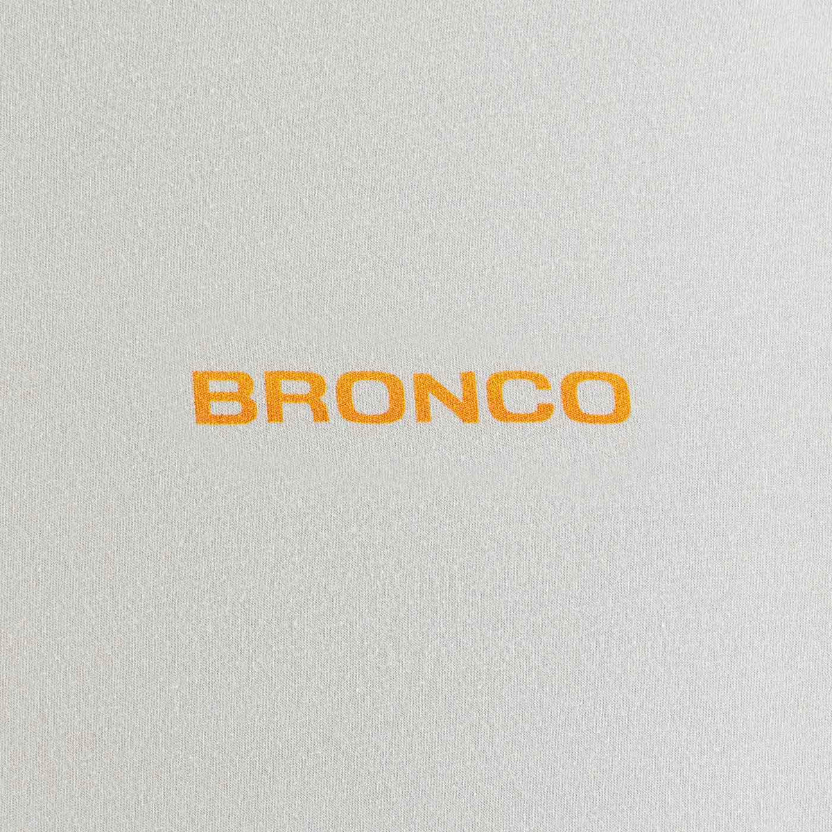 Text 'BRONCO' in orange on a textured gray background