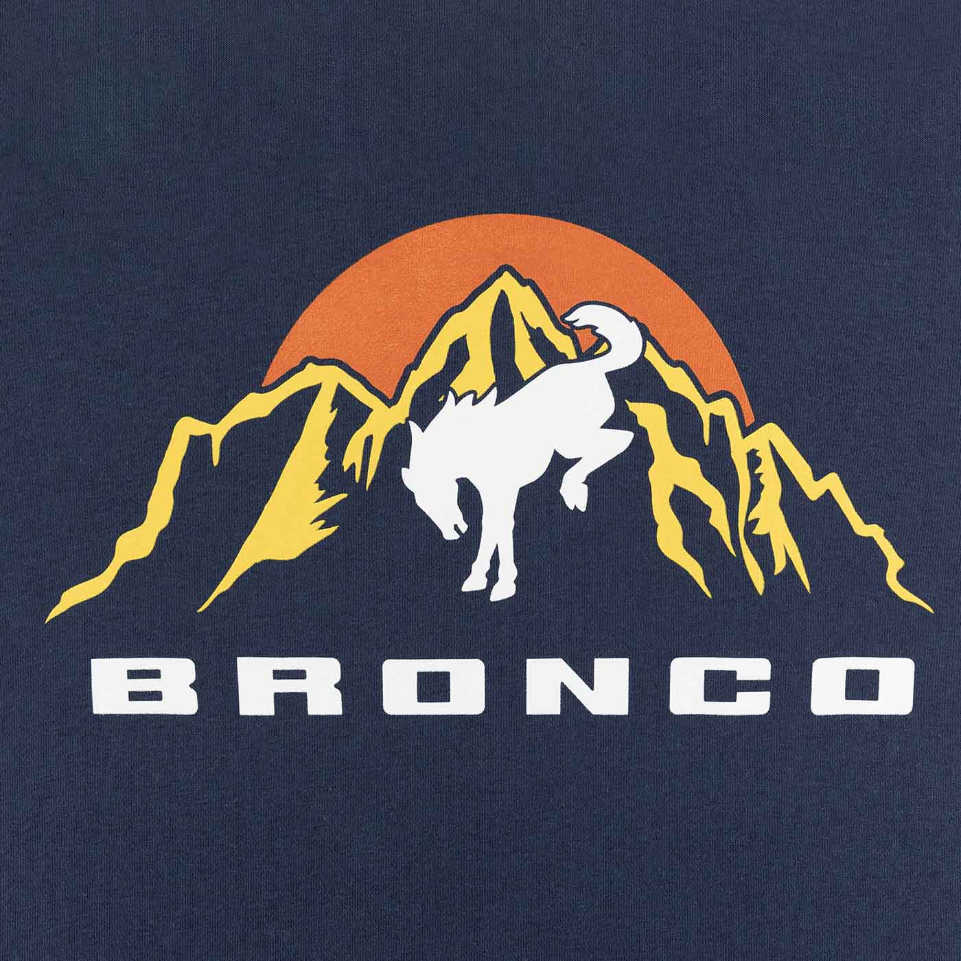 close up of yellow mountain graphic with orange sun and white bronco text on blue background