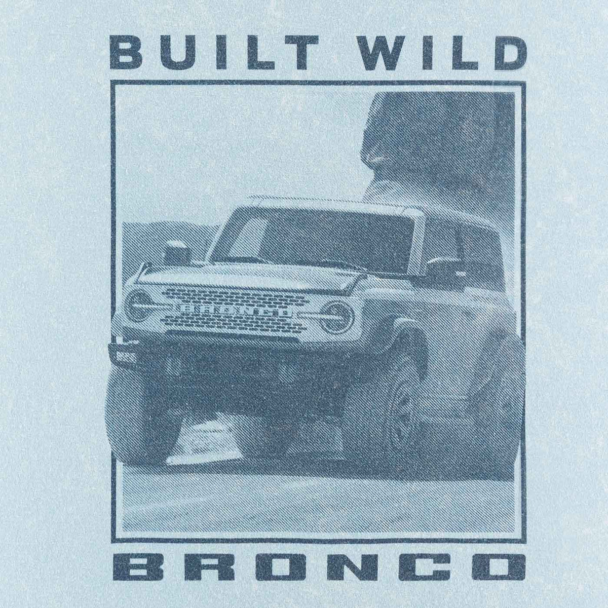 close up of Built Wild Bronco of Bronco vehicle off-roading in desert on blue background