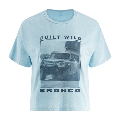 A blue women's t-shirt with a graphic print of a Ford Bronco and the text 'BUILT WILD BRONCO'. The shirt is displayed on a white background.