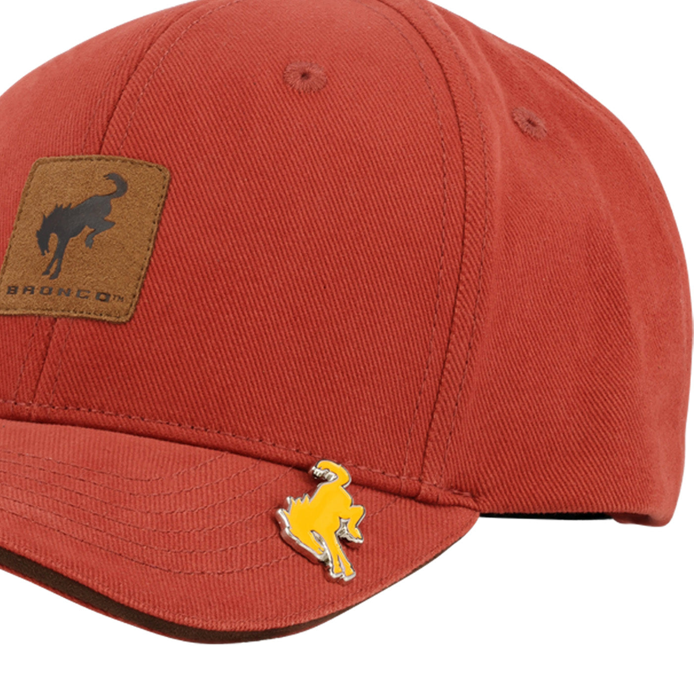Red cap with a leather patch and gold horse emblem on a white background
