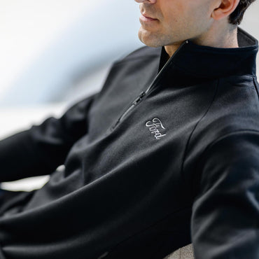 man in black ford script collard quarter ziip