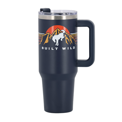 white bucking bronco in front of mountains and sun graphic with Built wild script on navy blue tumbler with handle