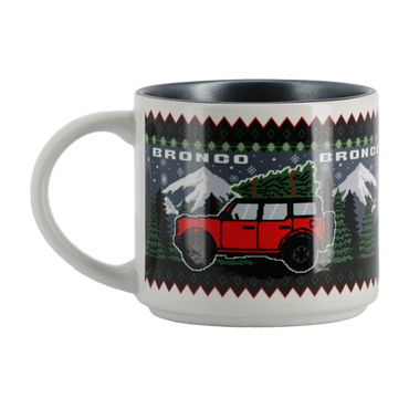Mug with a Broncos design featuring a red vehicle and Christmas tree on a white background