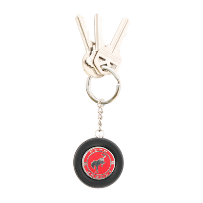 Keychain with a red and black design on a white background