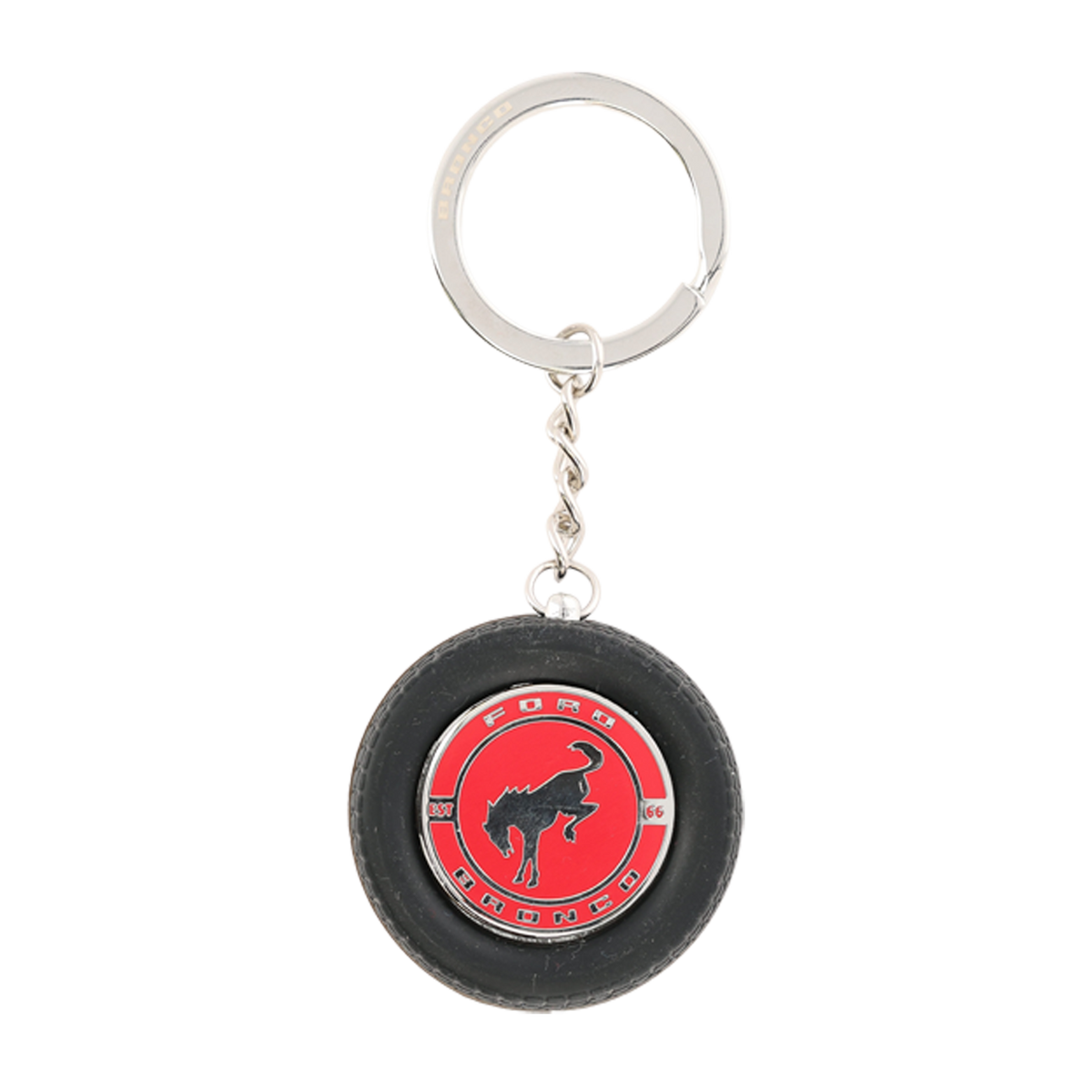 Keychain in the shape of a small tire with a red center and logo on a white background