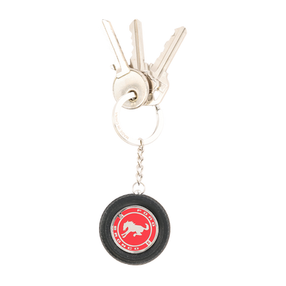 Keychain with a red and black logo on a white background
