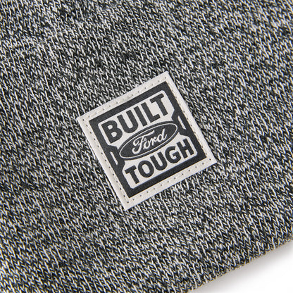 Close-up of a 'Built Ford Tough' label on textured fabric.