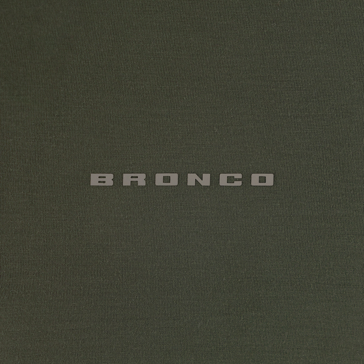Dark green shirt with 'Bronco' logo on a dark green background