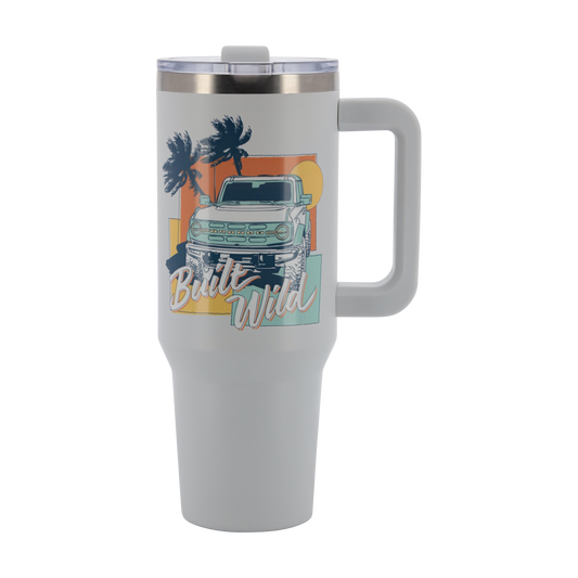 Travel mug with a graphic of a Ford Bronco  truck and palm trees on a white background