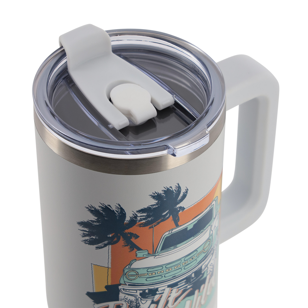 Travel mug with handle and lid featuring a palm tree and car design on a white background