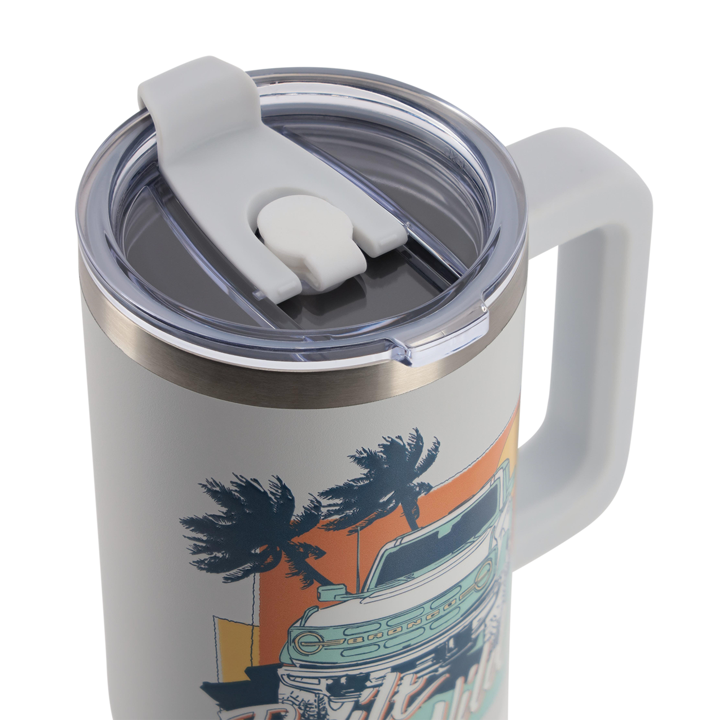 Travel mug with handle and lid featuring a palm tree and car design on a white background