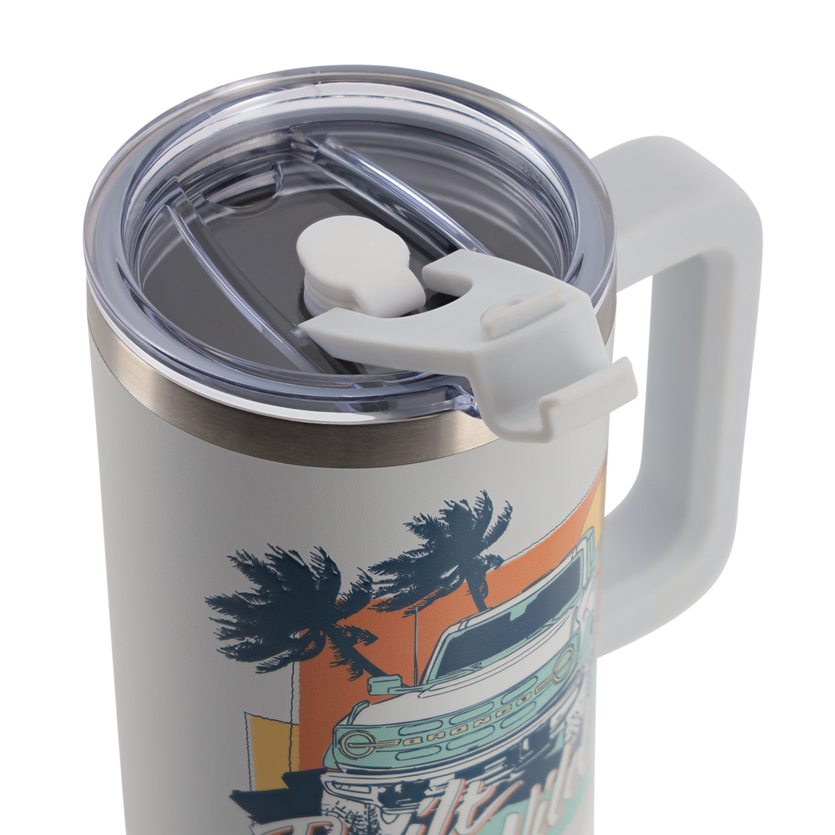 Travel mug with handle and palm tree design on a white background