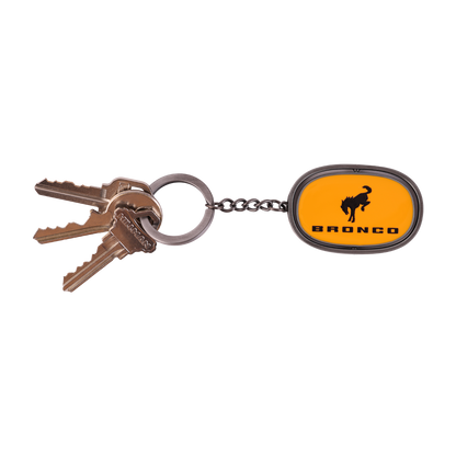 orange Bronco key chain with a key ring and keys attached