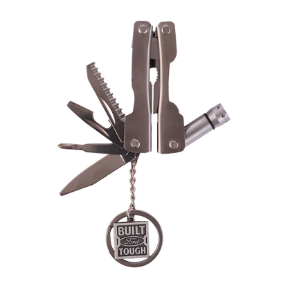 Multitool with multiple tools and a 'Built Ford Tough' charm on a white background