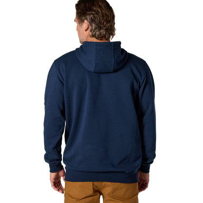A man viewed from the back wearing a navy blue pullover hoodie and tan pants against a plain white background.