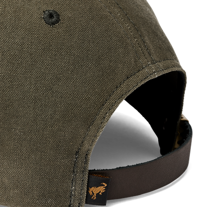 close up of a green hat with a brown leather strap and a brono tag