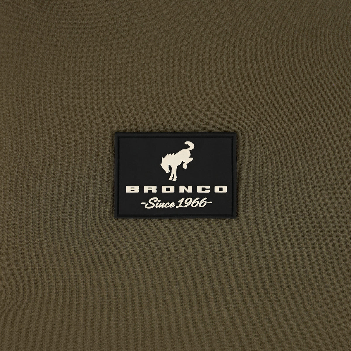 close up of a Bronco since 1966 silicone patch on a green background