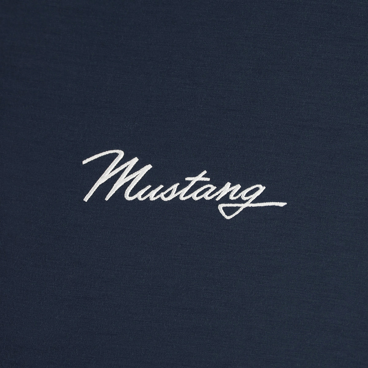 close up of white mustang script text on a navy blue background