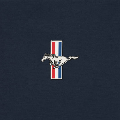 close up of a Ford Mustang tribar pony logo on a navy blue background
