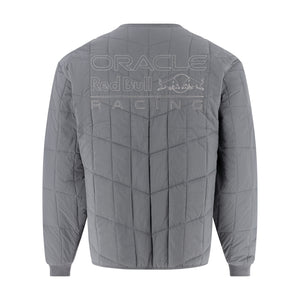 A gray quilted jacket shown from the back, featuring a large tonal 'ORACLE Red Bull Racing' logo printed across the upper back.