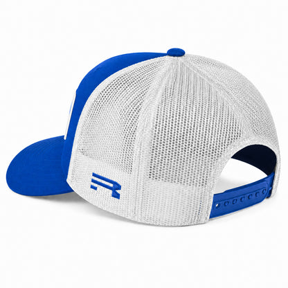 A blue and white trucker-style baseball cap shown from a three-quarter rear angle on a clean white background. The cap features a royal blue visor, blue front panel, blue button, and blue adjustable strap, with a white mesh back and a blue stylized 'R' logo on the side.