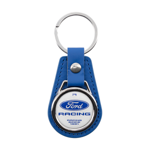 A blue leather keychain featuring a circular silver-tone metal emblem with the Ford Racing logo and text, attached to a silver split ring and blue strap on a white background.