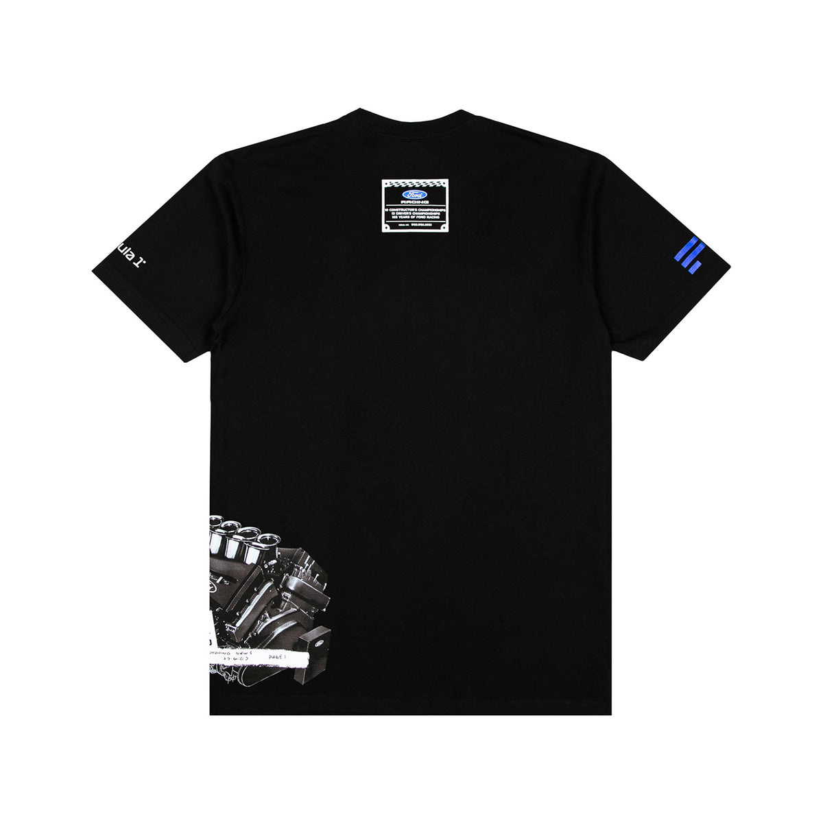 A black short-sleeve t-shirt shown flat against a white background, featuring a detailed engine graphic on the lower left, a small rectangular patch on the upper back, a white graphic on the right sleeve, and blue stripes on the left sleeve.