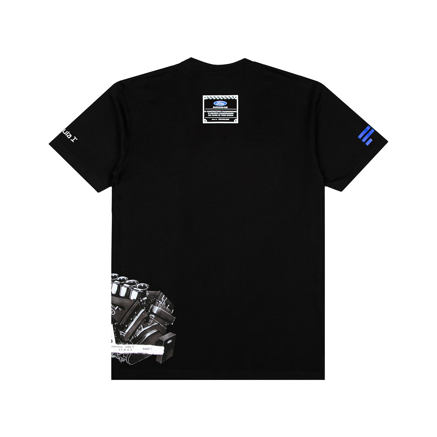 A black short-sleeve t-shirt shown flat against a white background, featuring a detailed engine graphic on the lower left, a small rectangular patch on the upper back, a white graphic on the right sleeve, and blue stripes on the left sleeve.