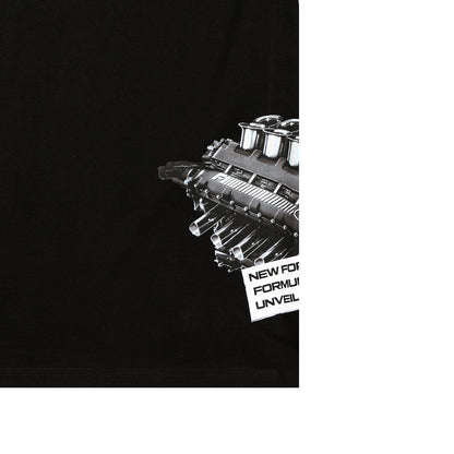 Close-up of a black garment featuring a detailed black-and-white engine graphic and partial white text reading 'NEW FORMULA 1' on the right side.
