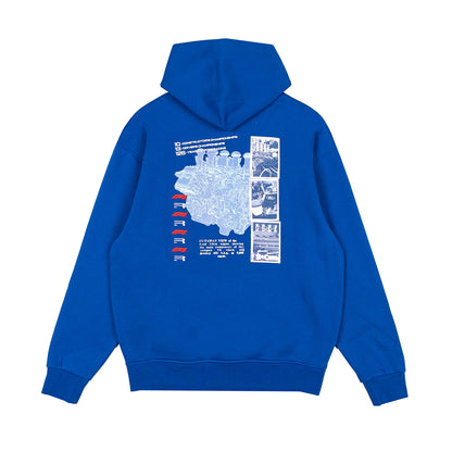 A royal blue pullover hoodie shown from the back, featuring a large white graphic print with a map, comic-style panels, and small red and white flag-like elements on a plain white background.