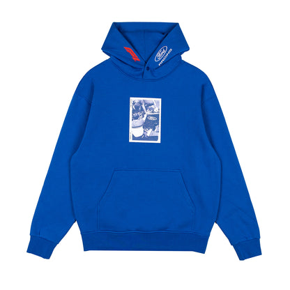 A royal blue pullover hoodie with a front kangaroo pocket and a blue-and-white graphic print on the chest. The hood features a white embroidered Ford logo on the right side and a red accent tab on the left.