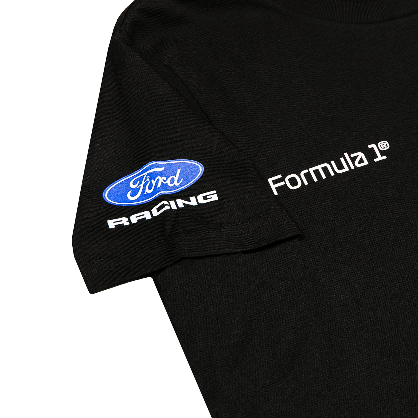 Close-up of a black short-sleeve T-shirt showing the left sleeve with a blue and white Ford Racing logo and white 'Formula 1' text on the chest, against a white background.