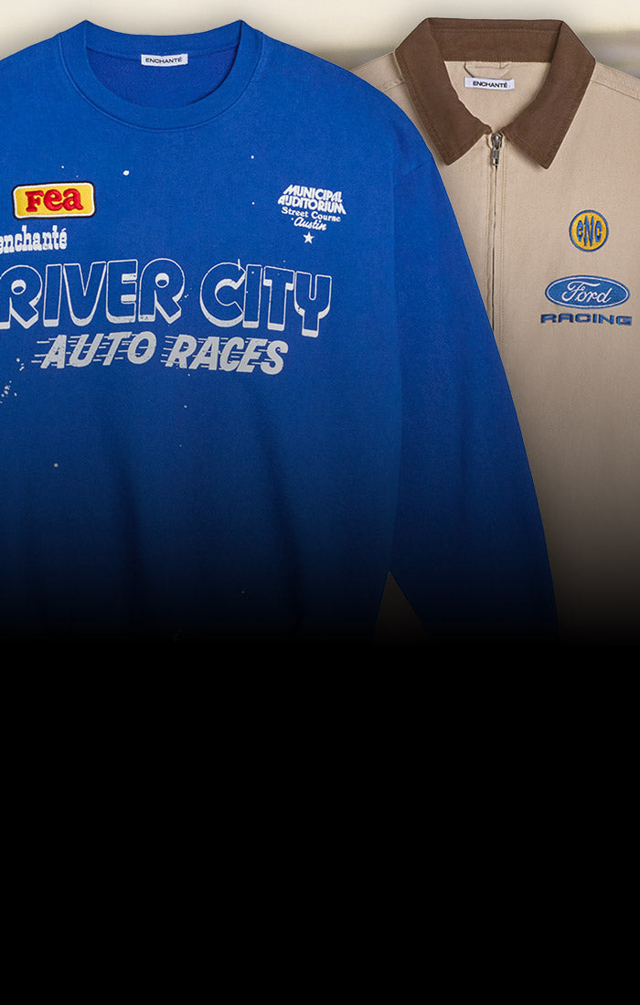 River city auto races crewneck in blue in front of a canvas Ford Racing jacket