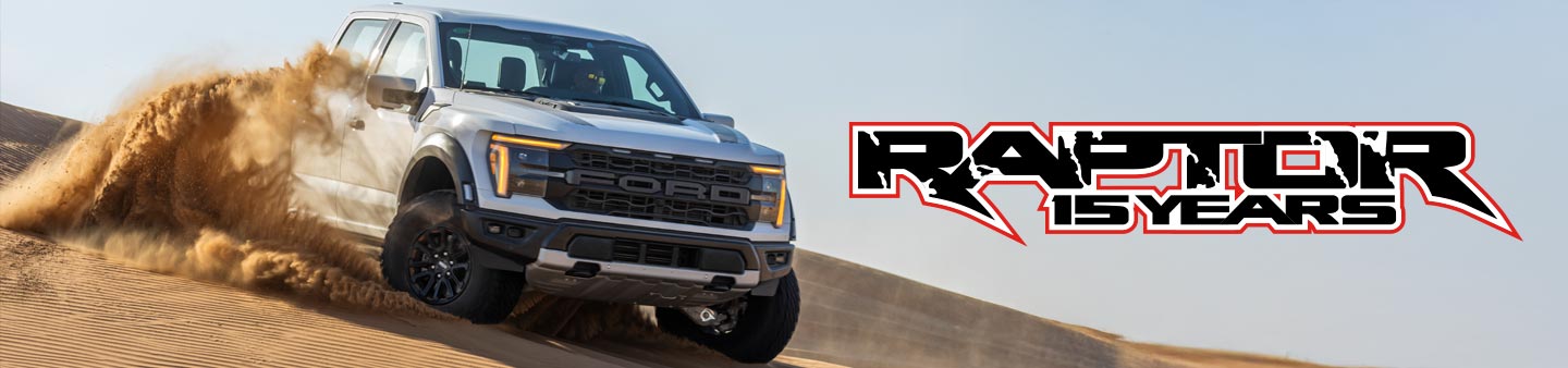 ford raptor racing down sand dune with raptor 15 years logo 