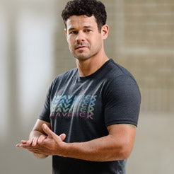 Man in a black Ford Maverick t-shirt with a blurred background