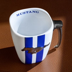 Mug with 'Mustang' branding and a logo on a brown background