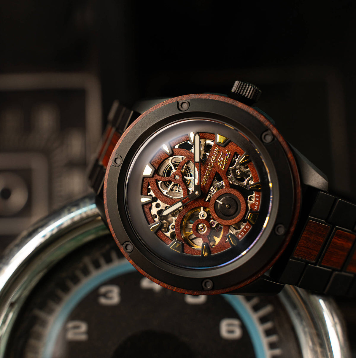 Close-up of a mechanical watch with a detailed movement on a dark background