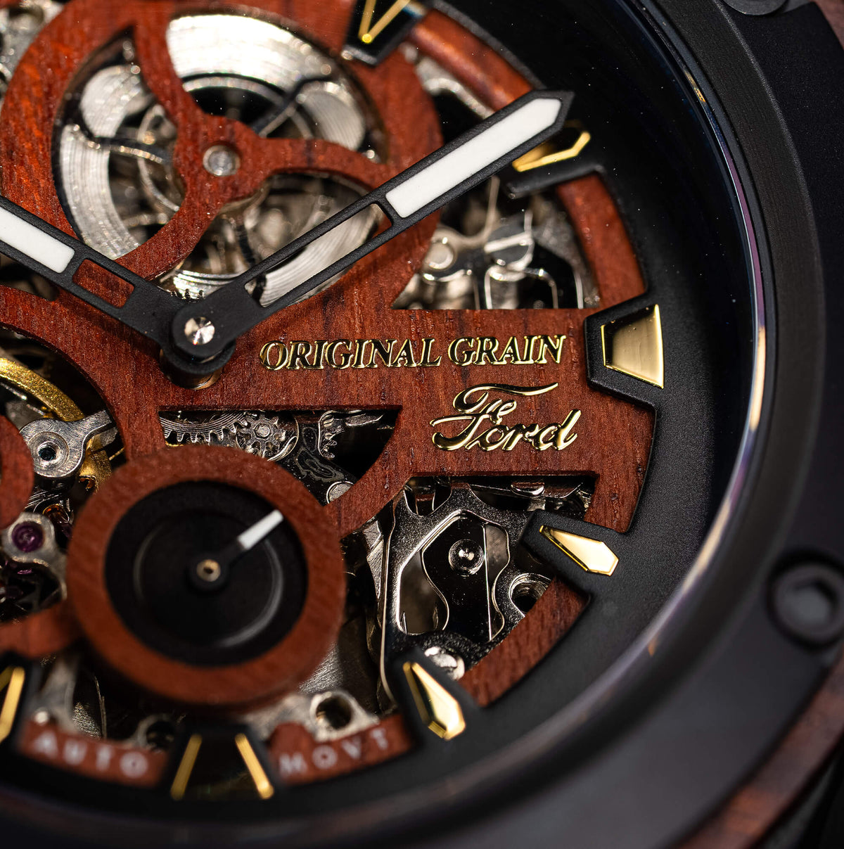 Close-up of a mechanical watch with wooden and metal components, featuring the brand 'Ferrel'.