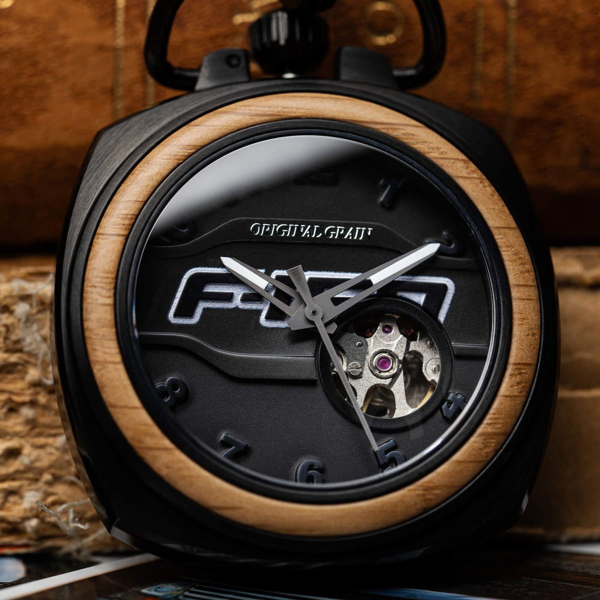 Close-up of a Ford F-150 watch with wooden bezel and visible brand logo.